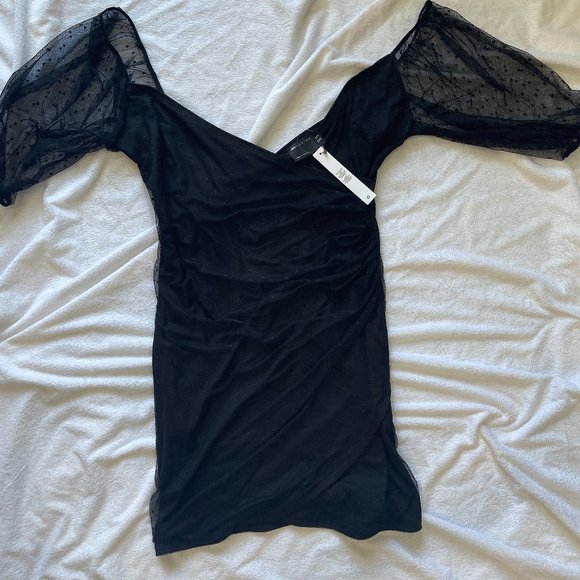 Striking and Sophisticated: Stand Out in Style with this Sheer Black Mesh Dress - Picture 1 of 2